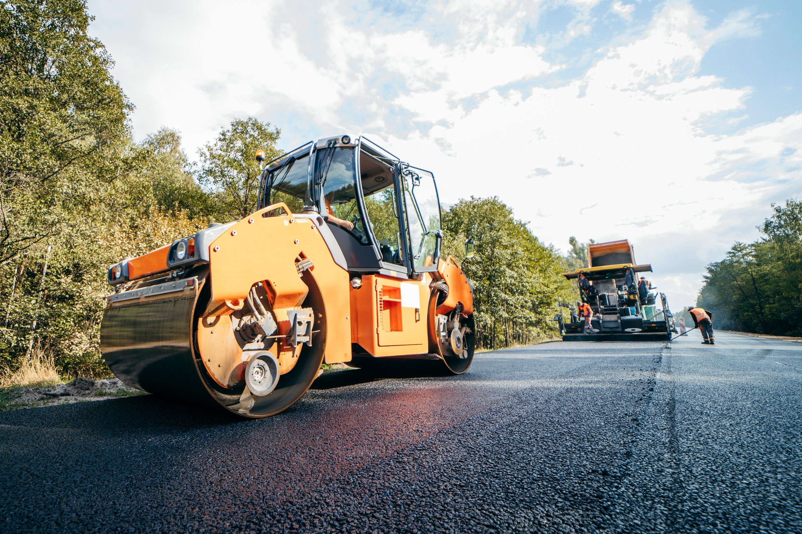 Road construction with asphalt paving
